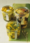 Three jars of different pickled cheeses to give as gifts