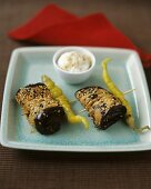 Fried aubergine rolls with sesame seeds