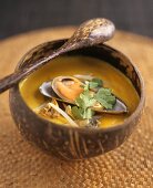 Shellfish soup in a wooden bowl
