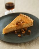 A piece of almond tart with sultanas