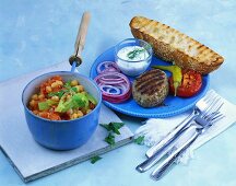 Chick-pea stew with peppers and grilled burger