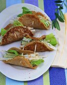 Buckwheat pancakes filled with avocado cream & celery sticks