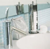 Make-up bag and make-up pads on a wash basin