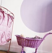 A bedstead and a doll's pram