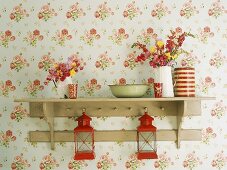 Vases and lanterns on shelf