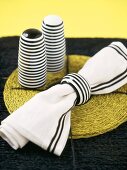 Black and white striped napkin and salt and pepper pots