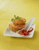 Heidesand cookies with ham, sesame seeds & red pepper dip