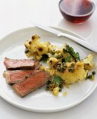 Beefsteak with fried cauliflower and capers