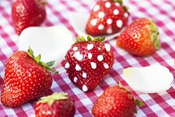 Strawberries with icing sugar dots