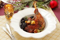 Roasted goose leg with dried plums