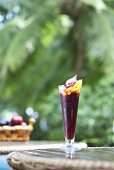 A glass of sangria on a bistro table