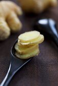 Sliced ginger on a spoon
