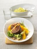 Veal medallions with Chinese cabbage and orange fillets