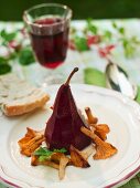 Red wine pear with chanterelle mushrooms