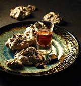 Chocolate cornflakes macaroons and a glass of liqueur
