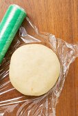 Biscuit dough with clingfilm