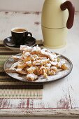 Crostoli (deep fired Italian pastries with icing sugar)