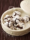 Snow caps (chocolate cookies with icing sugar) in biscuit box