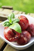 Grilled tomatoes wrapped in bacon