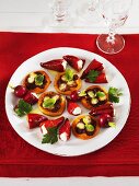 Plate of appetisers (pizzette & stuffed chillies)