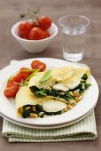Pancakes filled with spinach, mozzarella and pine nuts