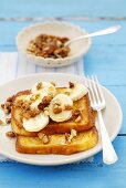 French toast with banana, maple syrup and walnuts