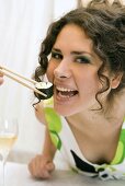 Woman being fed sushi
