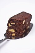 Nut brownie on a cake server