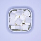 Sugar cubes in a square bowl (overhead view)
