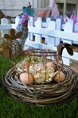 Eggs in hen-shaped basket in Easter nest