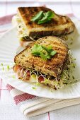 Raw ham, Comte cheese, gherkins & alfalfa sprouts in toast sandwich