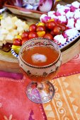 Iced tea in glass, assorted appetisers