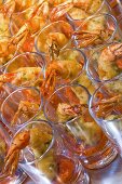 Deep-fried prawns in glasses on a buffet