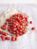 Plum tomatoes on paper