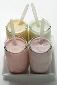 Four different fruit yoghurts in jars