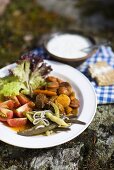 Lamb stew with bean salad and tomatoes, garlic yoghurt