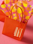 Orange gift bag and wrapping paper
