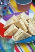 Triangular soft cheese sandwiches for a party