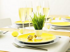 Laid Easter table with glasses of sparkling wine
