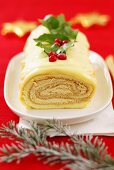 Sponge roll with coffee cream filling and white chocolate (Christmas)