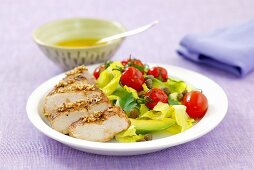 Chicken breast with avocado and cocktail tomatoes