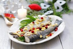 Trout with flaked almonds, herbs and cranberries