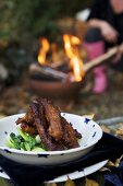 Glazed pork ribs on pak choi