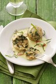 Spinach dumplings with cream sauce