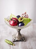 Christmas tree ornaments in shape of fruit & veg in crystal pedestal bowl