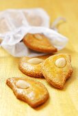 Half-moon-shaped almond biscuits with fabric bag