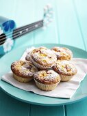 Peach muffins dusted with icing sugar