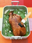 Roast duck with a vinegar-caramel sauce and mangetout