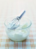 Whipped cream in a glass bowl