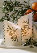 Lanterns decorated with olive branches